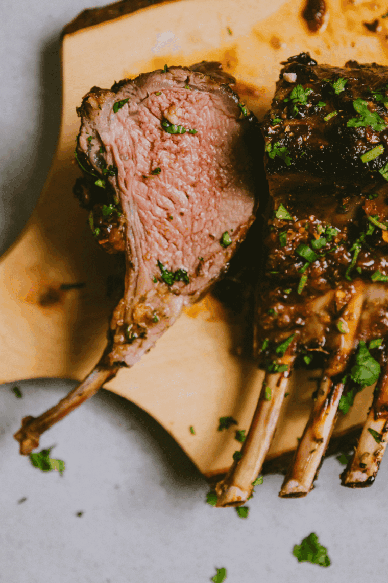 Juicy Traeger lamb chops grilled with garlic, herbs, and lemon for smoky flavor