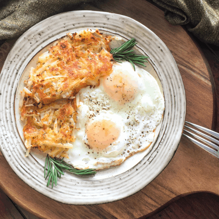 Homemade Waffle House hash browns cooked golden brown and crispy in a skillet.