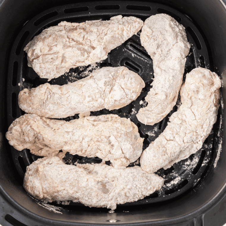Place Wingstop Copycat Hot Honey Chicken Tenders in the air fryer basket.