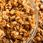 Homemade nut-free granola baked until golden, served in a bowl with oats, seeds, and dried fruit.