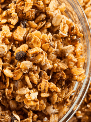 Homemade nut-free granola baked until golden, served in a bowl with oats, seeds, and dried fruit.