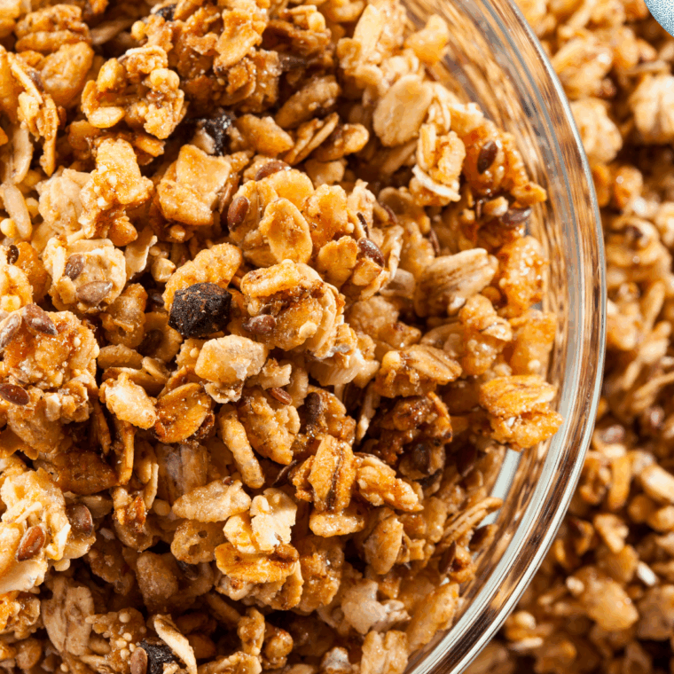Homemade nut-free granola baked until golden, served in a bowl with oats, seeds, and dried fruit.