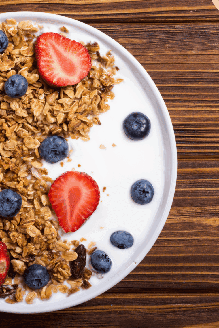 Homemade nut-free granola with oats, seeds, and dried fruit in a bowl.