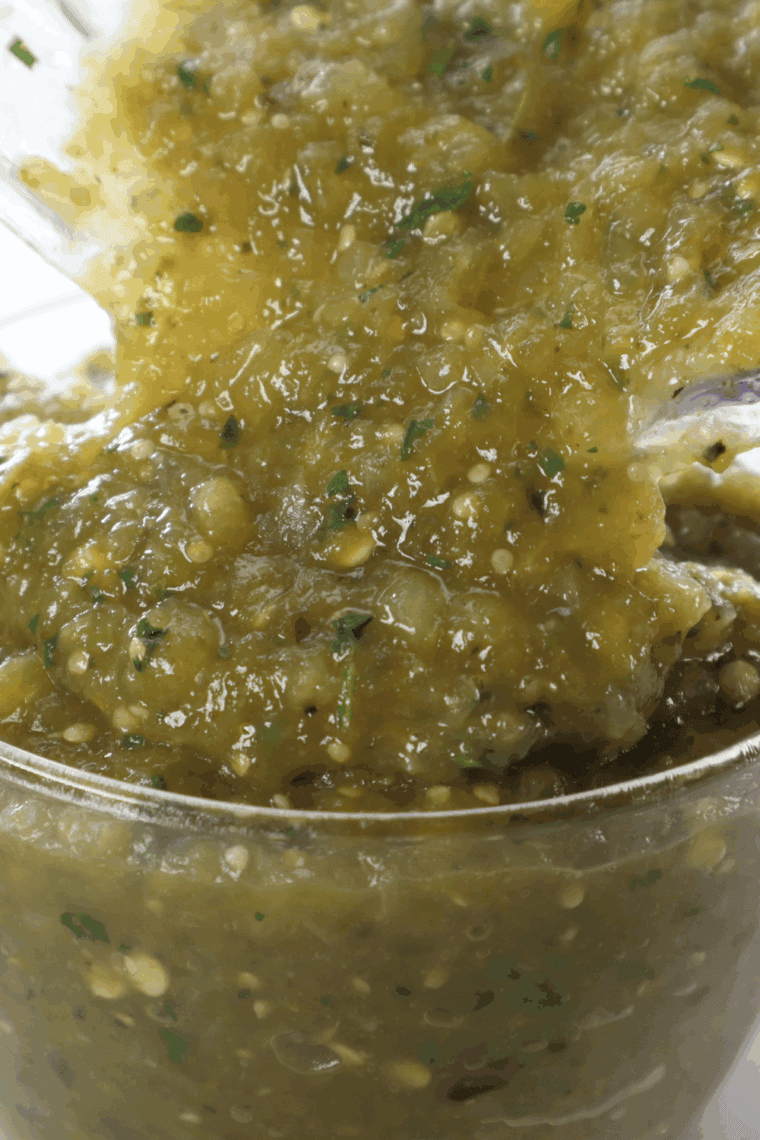Homemade Abuelo's CopyCat Fresh Tomatillo Salsa is paired in a bowl with tortilla fries.