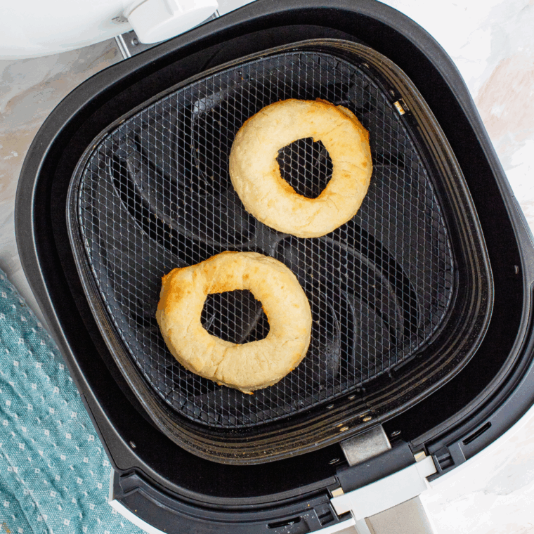 Cooked Greek Yogurt Donuts in the air fryer basket.