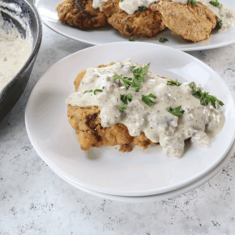 Plate of Bob Evan's Country Fried Steak with gravy on top.