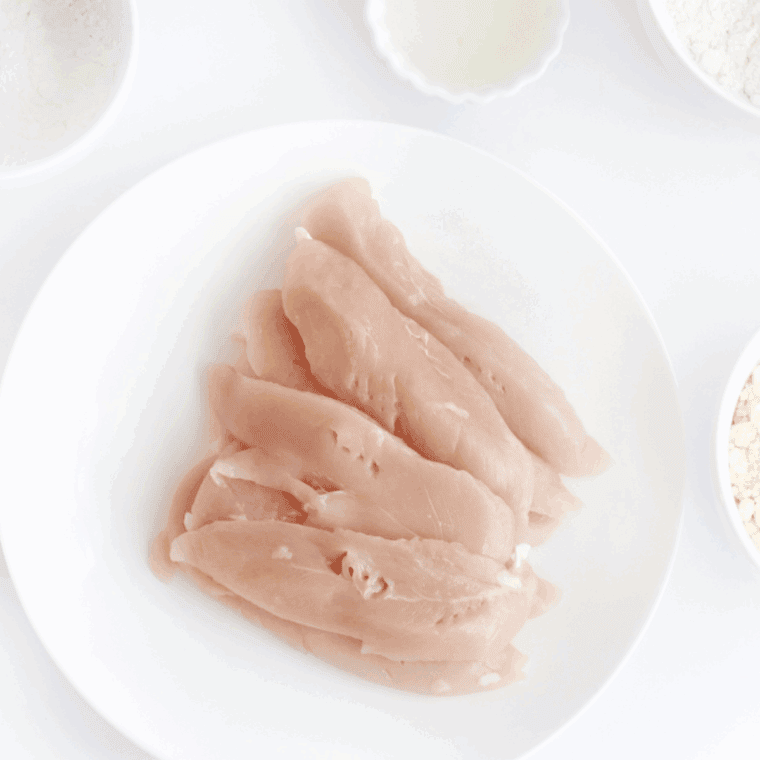 Fresh chicken tenders cut into slices and patted dry to bread.
