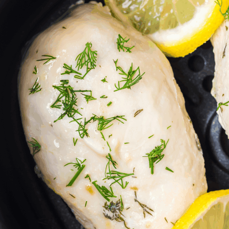 Close up of Bob Evan’s Lemon Garlic Chicken Recipe in the air fryer basket.