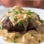 Enjoy the classic comfort of Bob Evans right at home with this Mushroom and Onion Chopped Steak recipe. Tender, juicy beef patties are topped with savory sautéed mushrooms and onions and smothered in rich, flavorful gravy. This easy-to-make dish is perfect for weeknight dinners or any time you’re craving a hearty, family-friendly meal that delivers all the warmth and flavor of a homemade favorite.