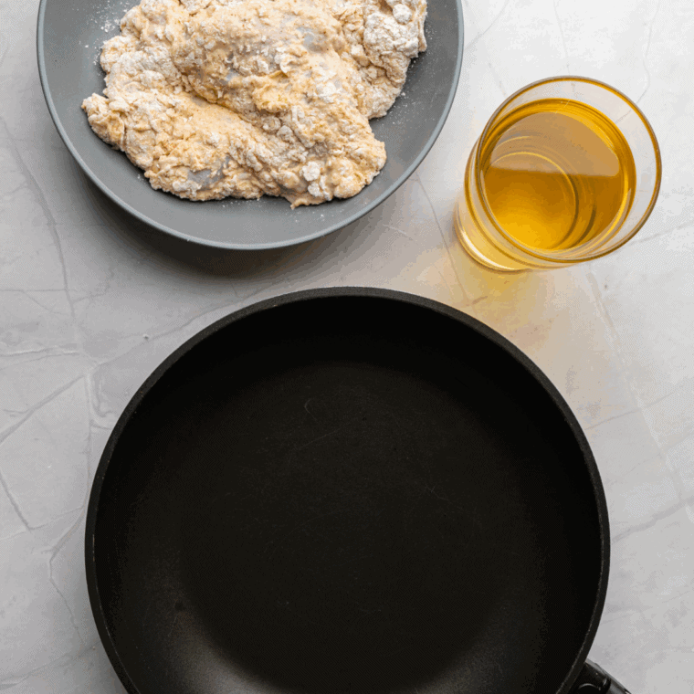 Crispy, golden fried chicken resting on paper towels, ready to serve with sides.