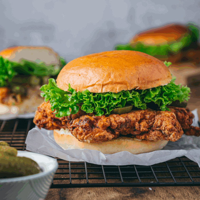 Golden, crispy Bojangles-style fried chicken served hot on a plate, ready to eat.