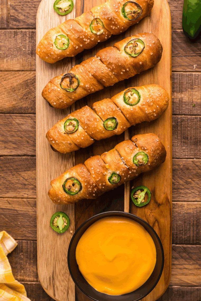 A bowl of warm, cheesy parody Anne's Dip with soft pretzels.