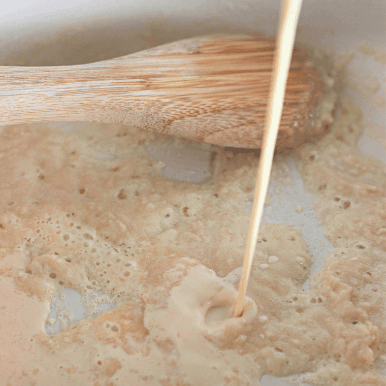 Stir the melted butter and flour in a pan to form a smooth roux.