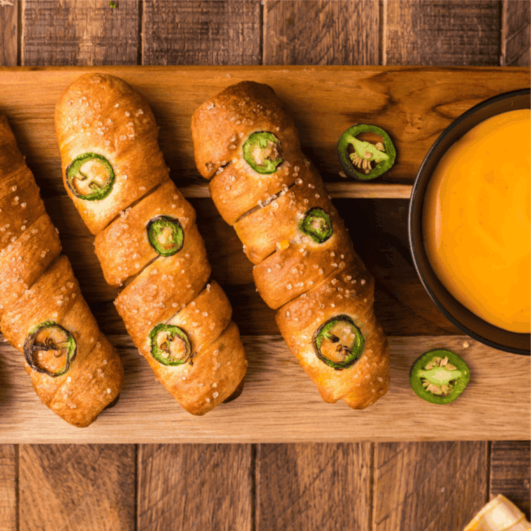Homemade parody Anne's cheese dipped in a bowl with soft pretzels.