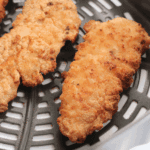 Air fryer homemade Dairy Queen-style chicken strips golden and crispy on a plate