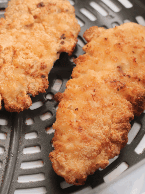 Air fryer homemade Dairy Queen-style chicken strips golden and crispy on a plate