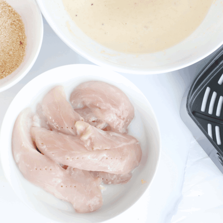 Ingredients needed for Copycat Dairy Queen Chicken Strips Recipe on kitchen table.