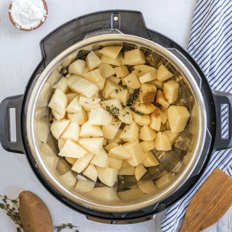 Add potatoes and broth: Peeled and diced potatoes added to the Instant Pot with chicken or vegetable broth.