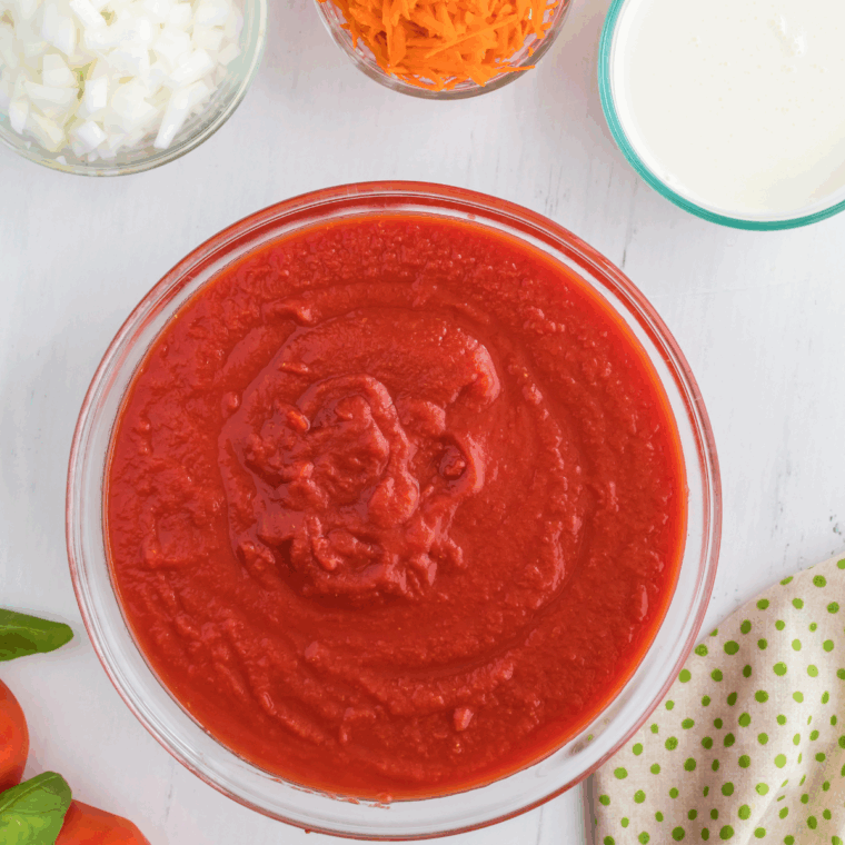 Ingredients needed for Copycat Jason's Deli Tomato Soup on kitchen table.
