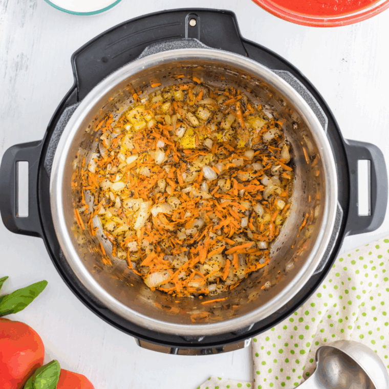 Sautéing onions, garlic, and carrots in Instant Pot for soup base