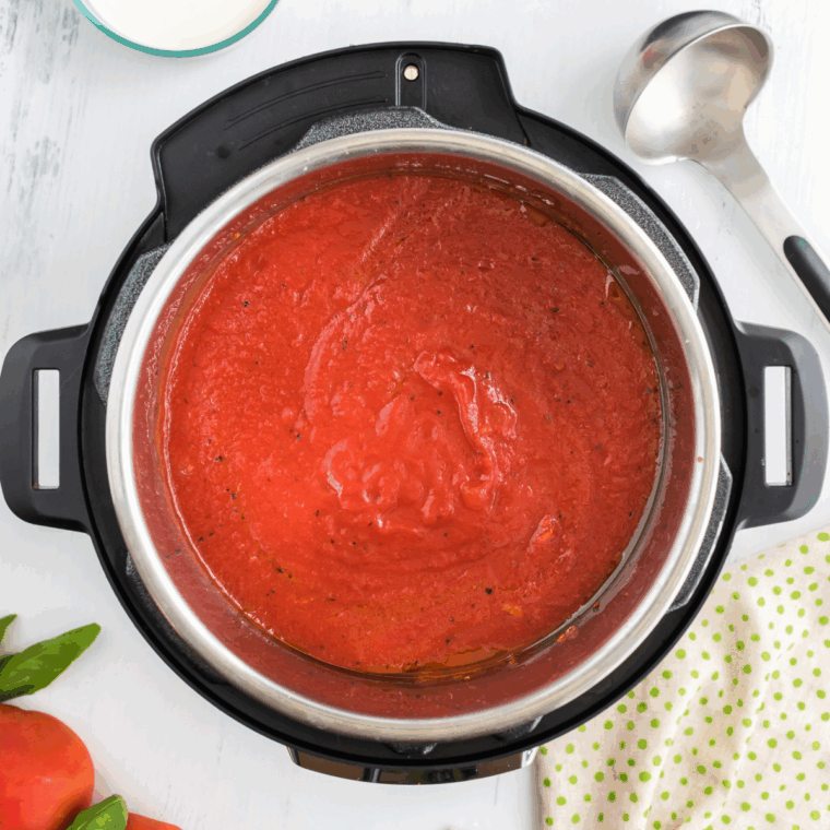 Mixing tomato paste into sautéed vegetables in Instant Pot
