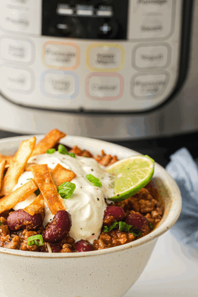 Copycat Tim Hortons Chili served hot in a bowl with cheese