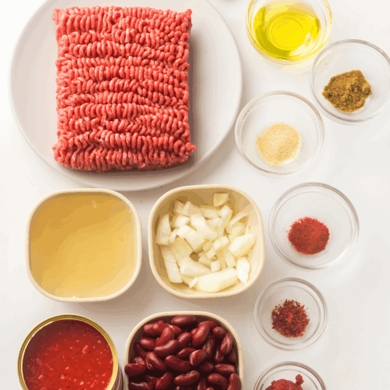 Ingredients needed for Copycat Tim Hortons Chili Recipe on kitchen table.