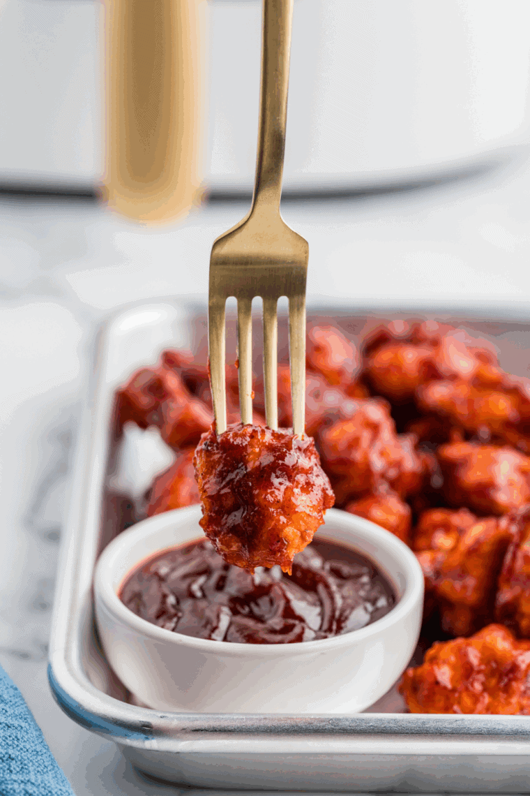 Homemade dairy queen style barbecue sauce in a small bowl with spoon