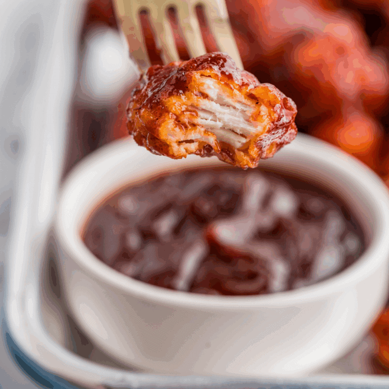 Homemade Dairy Queen-style BBQ sauce in a small glass bowl with a spoon
