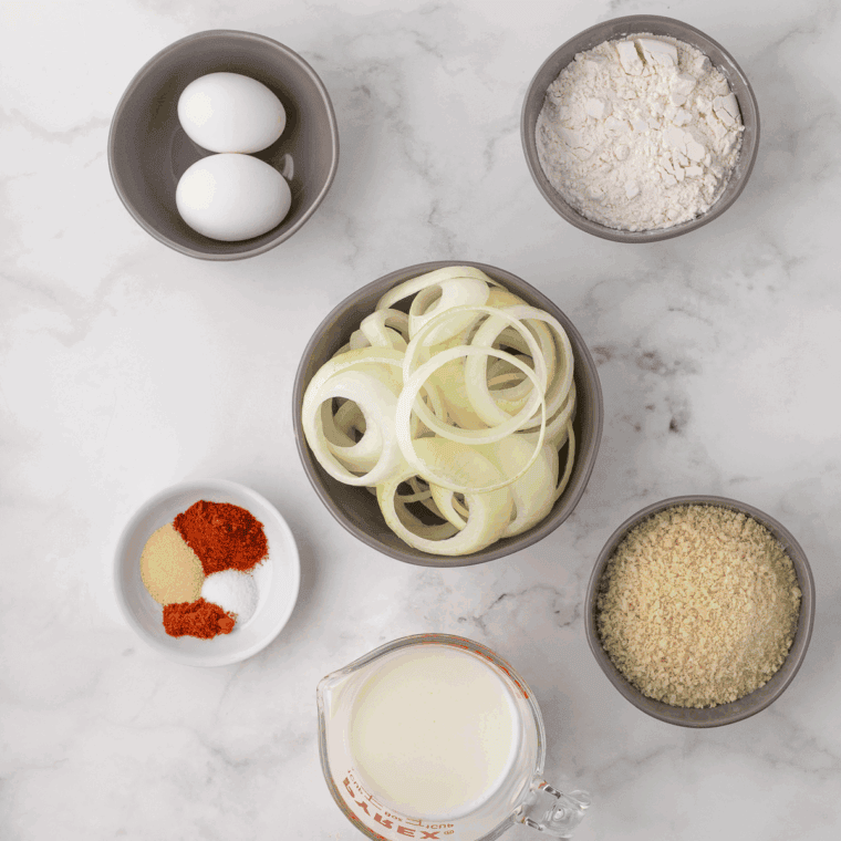 Ingredients needed for Dairy Queen Onion Rings Recipe on kitchen table.