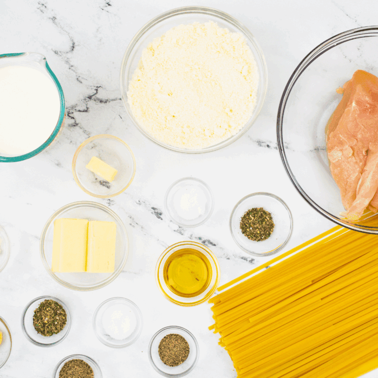 Ingredients needed for Dominos Chicken Alfredo Pasta Recipe on kitchen table.