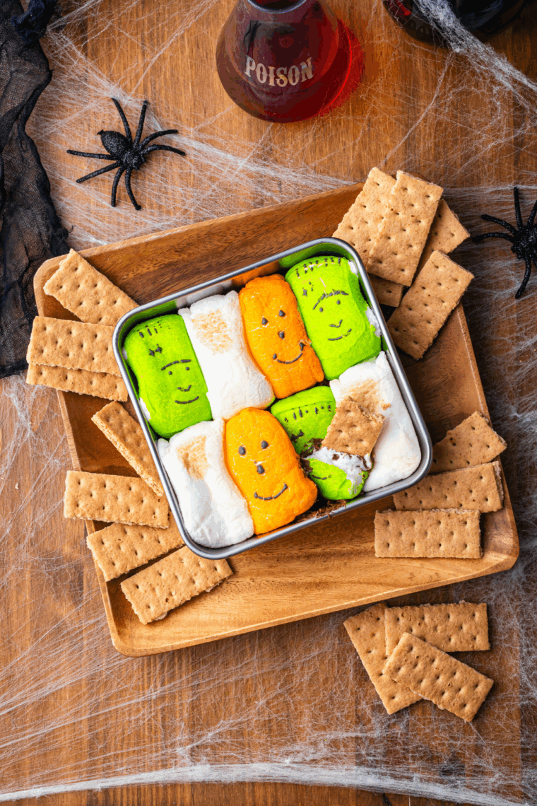 Halloween dessert dip with melted chocolate and graham crackers.