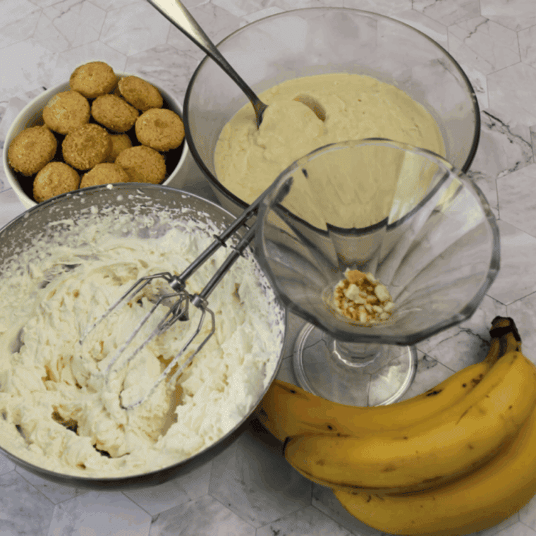 Assembling the Golden Corral Banana Pudding Recipe on the kitchen table.