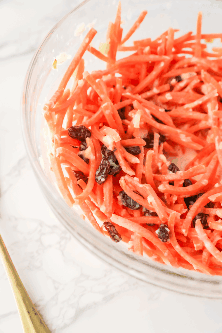 Bowl of Golden Corral Carrot and Raisin Salad on kitchen table.