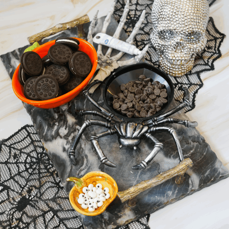 Ingredients needed for Halloween Black Cat Oreo Cookies on kitchen table.