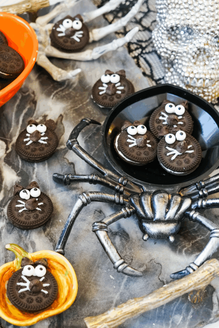 Plate of Halloween Black Cat Oreo Cookies on kitchen table.