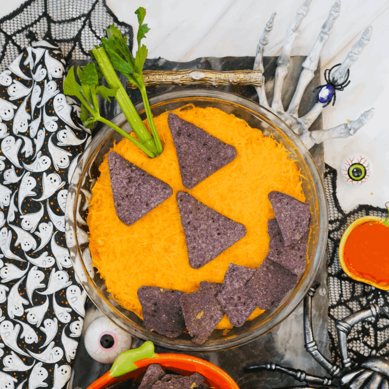 Creamy Halloween Boo-falo Wing Dip in a festive dish, served with tortilla chips.