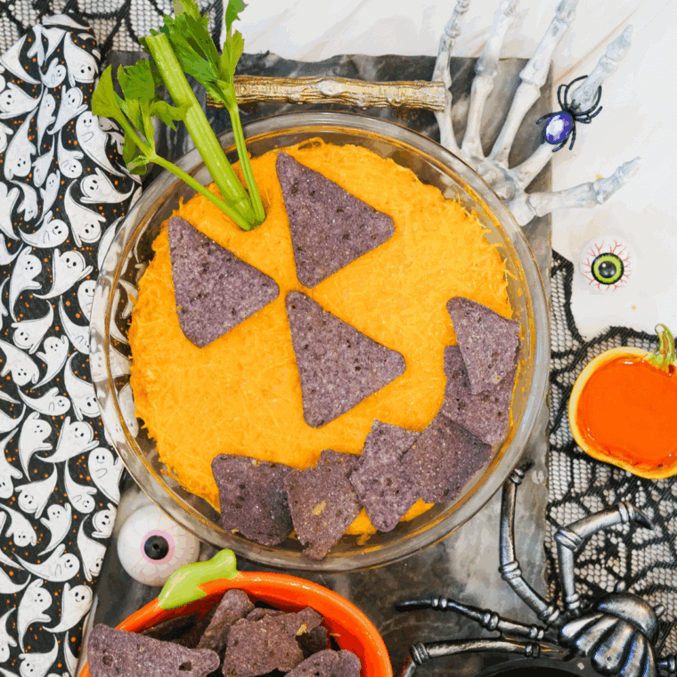 Halloween Boo-falo wings are dipped in baking and decorated with tortilla slices and celery stems, similar to pumpkin.