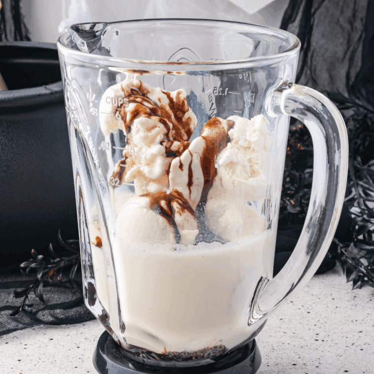 Blending vanilla ice cream, milk, chocolate syrup, and cinnamon into a creamy milkshake