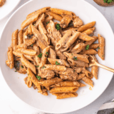 Homemade Cajun Alfredo sauce served over creamy pasta with a sprinkle of parsley.