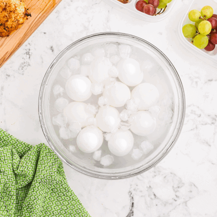 Place cooked eggs into the ice bath.