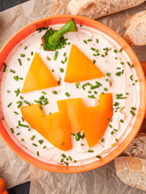 Serve up spooky fun with this Jack-O'-Lantern Onion Dip! Creamy, savory, and perfect for Halloween parties, it’s a festive dip everyone will love.