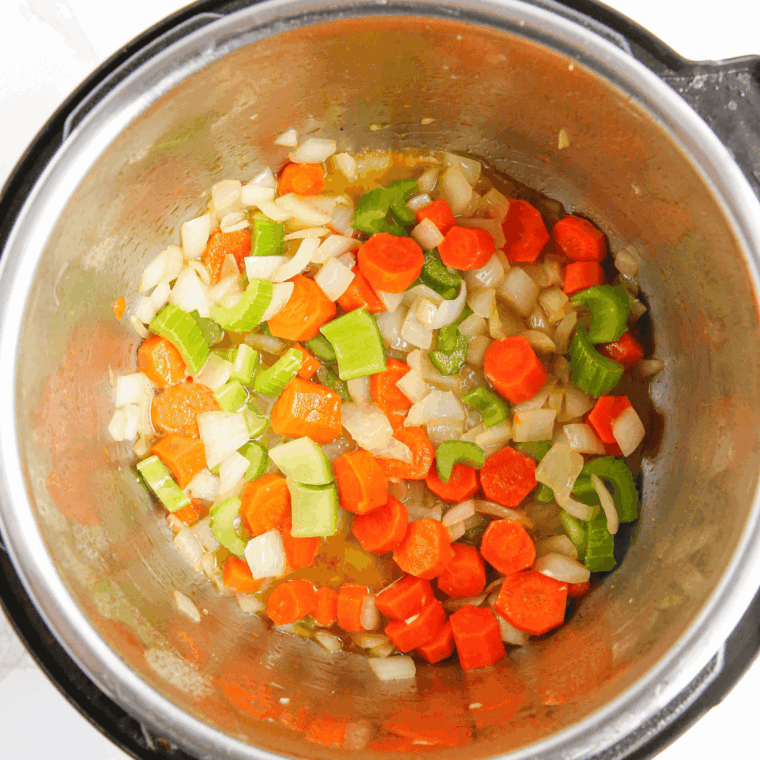 Saute the vegetables in the Instant Pot.