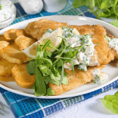 Crispy Long John Silver’s copycat fish with golden batter served with lemon wedges.