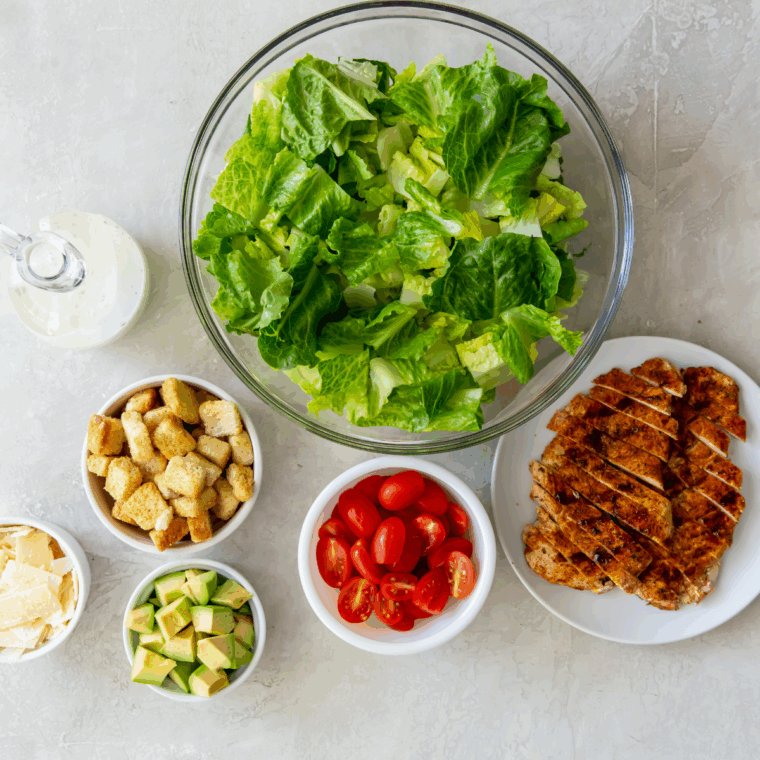 Ingredients needed for Longhorn Steakhouse Grilled Caesar Salad Recipe on kitchen table.