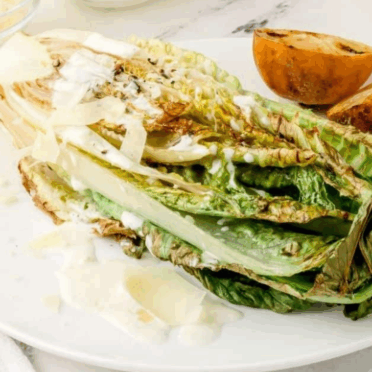 Longhorn Steakhouse Grilled Caesar Salad Recipe grilled on a plate.
