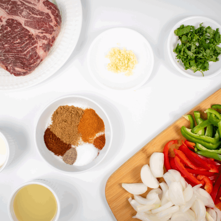 Ingredients needed for Lupe Tortilla Fajita Recipe on kitchen table.