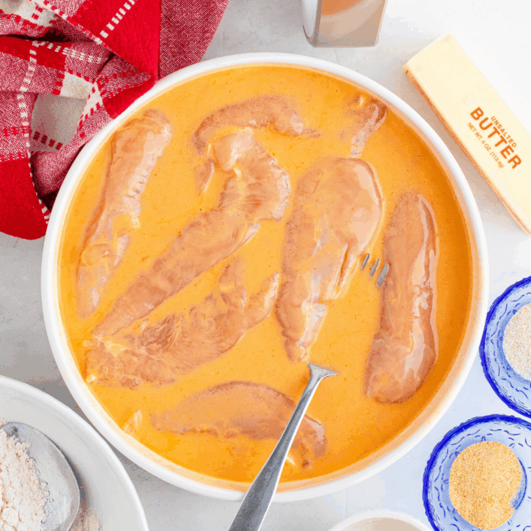 Let the chicken tenders marinade in the buttermilk.