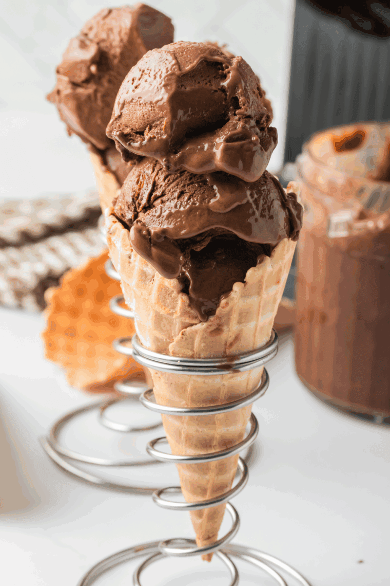 Homemade Ninja Creami Blue Bell Dutch Chocolate ice cream served in a bowl with chocolate chunks.