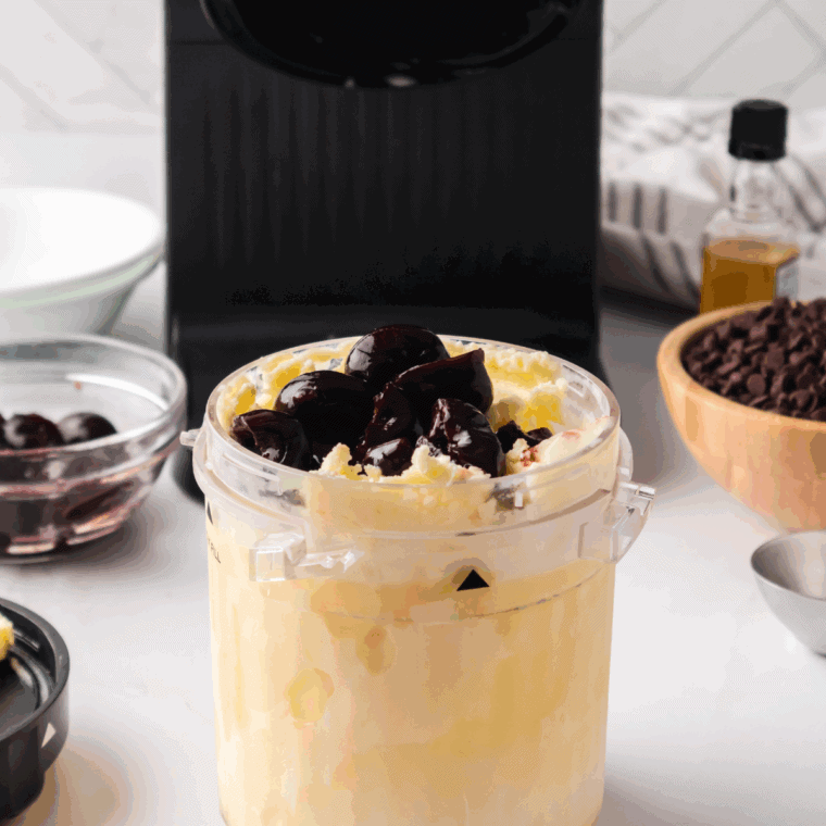 Adding chocolate chunks and dark cherries to ice cream and mixing in Ninja Creami.